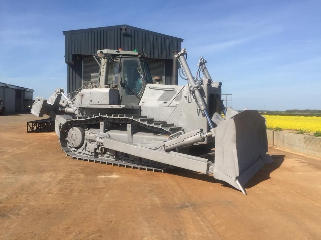 Large tracked construction equipment after surface preparation